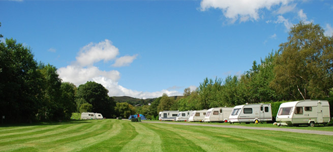 caravans in sunny field