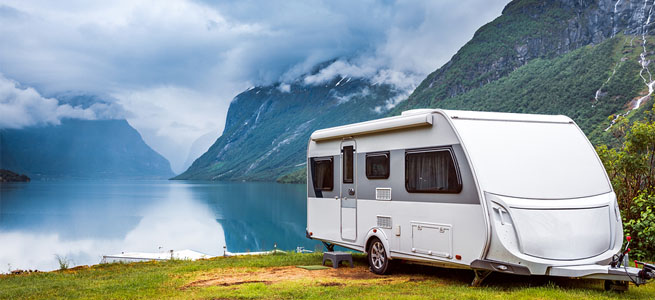 caravan parked in scenic location in the mountains