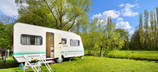 Caravan in a sunny field